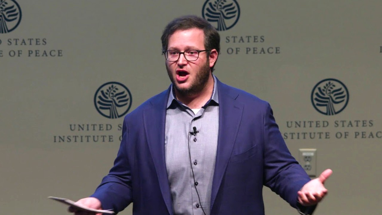 Oliver Libby speaking at the NEXUS USA Summit in 2018